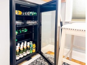 Conveniently stocked with a compact refrigerator for your essentials.