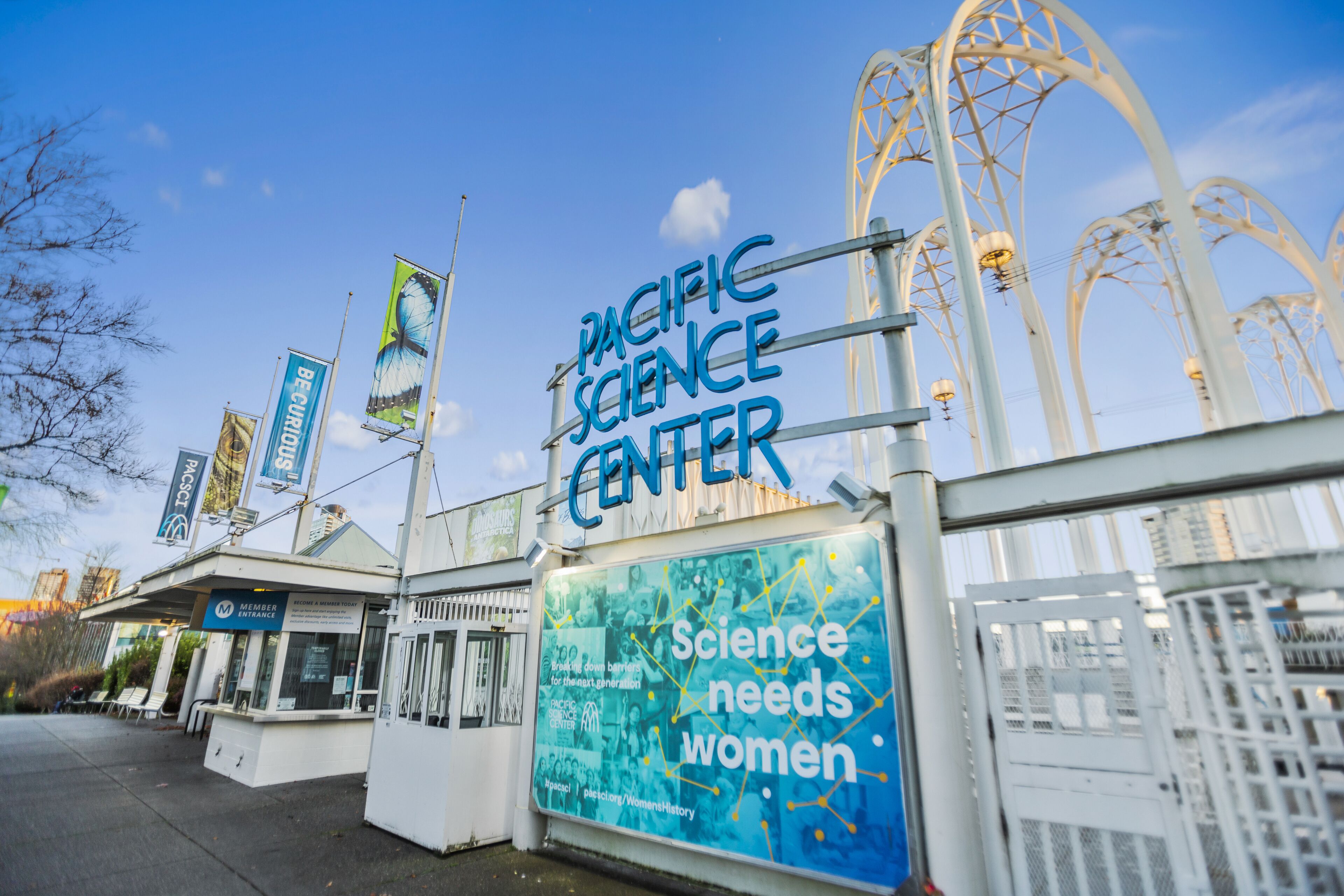 The Pacific Science Center with a prominent sign reading "Science needs women."