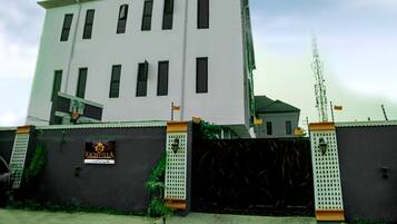 A multi-story building with a sign that reads "Richvilla."