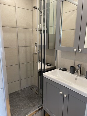 Shower, hair dryer, towels, soap