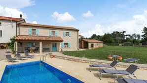 A two-story stone house with a swimming pool and outdoor seating. - Beautiful home in Buje (Buje)