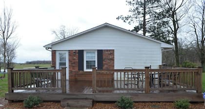 Country setting with mature trees, large deck. Game/Rec room, Fire Pit and Grill
