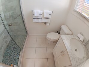 A bathroom with a glass shower enclosure, a toilet, and a marble sink. - 9 - Peaceful & Spacious 4B2B Upper Unit near FW (Daly City)