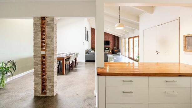 A modern kitchen with white cabinets and a wooden countertop. - Country Seaside Escape - Torquay (Surf Coast)