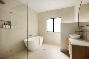 Combined shower/bathtub, hair dryer, towels, soap