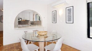 A modern kitchen with white cabinets, a microwave, and a sink. - Bayona 4 - Balcony Tranquility (Little Cove)