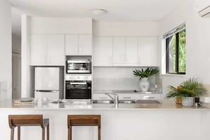 Coffee/tea maker, fridge, microwave, oven