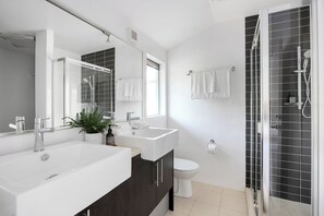 Combined shower/bathtub, hair dryer, towels, soap