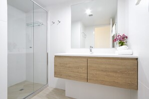 Shower, hair dryer, towels, soap