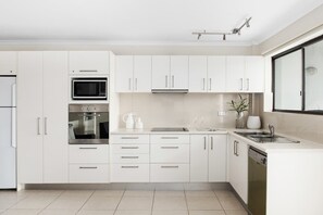 Coffee/tea maker, fridge, microwave, oven