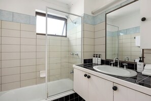 Combined shower/tub, hair dryer, towels, soap