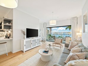 The Cocos Apartment at Palm View Collective | Living area | Flat-screen TV