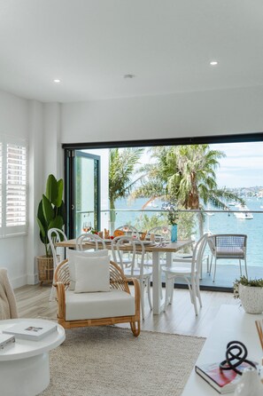 The Phoenix Apartment at Palm View Collective | Living area | Flat-screen TV - Palm View Collective (Elizabeth Bay)