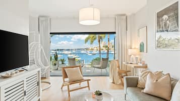 The Cocos Apartment at Palm View Collective | Living area | Flat-screen TV