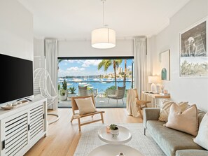 The Cocos Apartment at Palm View Collective | Living area | Flat-screen TV
