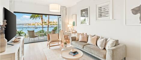 The Cocos Apartment at Palm View Collective | Living area | Flat-screen TV