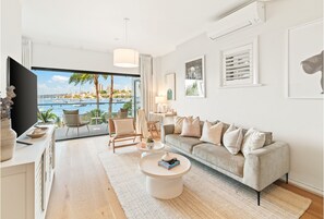 The Cocos Apartment at Palm View Collective | Living area | Flat-screen TV