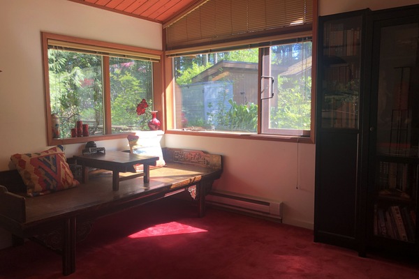 Living room with antique tea table.