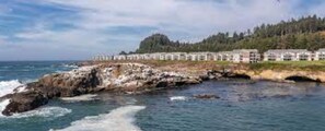 Situated on a rocky outcrop, this hotel offers stunning ocean views from its modern, uniformly designed buildings.