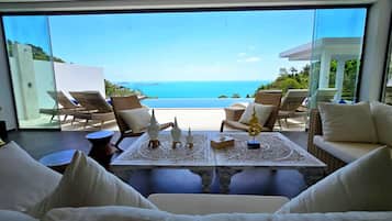 Luxury Villa | Living area | 85-inch Smart TV with cable channels, TV, Netflix