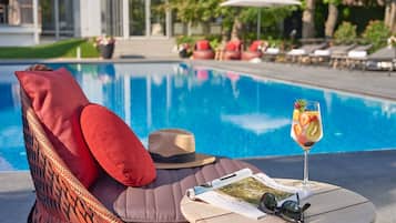 Seasonal outdoor pool, open 10:00 AM to 8:00 PM, pool umbrellas