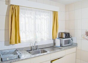Deluxe Apartment | Private kitchen | Fridge, microwave, cookware/dishes/utensils - Furnished Hub Nyayo Estate (Nairobi)