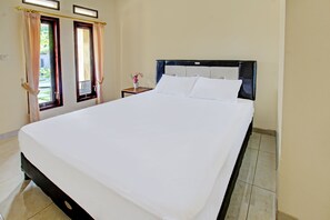 Laptop workspace, bed sheets