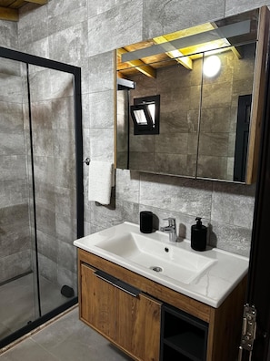 Shower, rainfall showerhead, hair dryer, towels