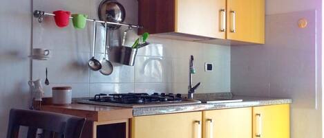 Fridge, stovetop, coffee/tea maker, cookware/dishes/utensils