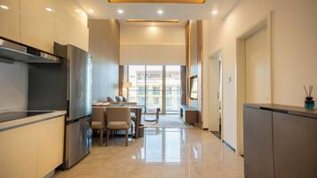 Romantic Suite | Living area | 65-inch LED TV with digital channels