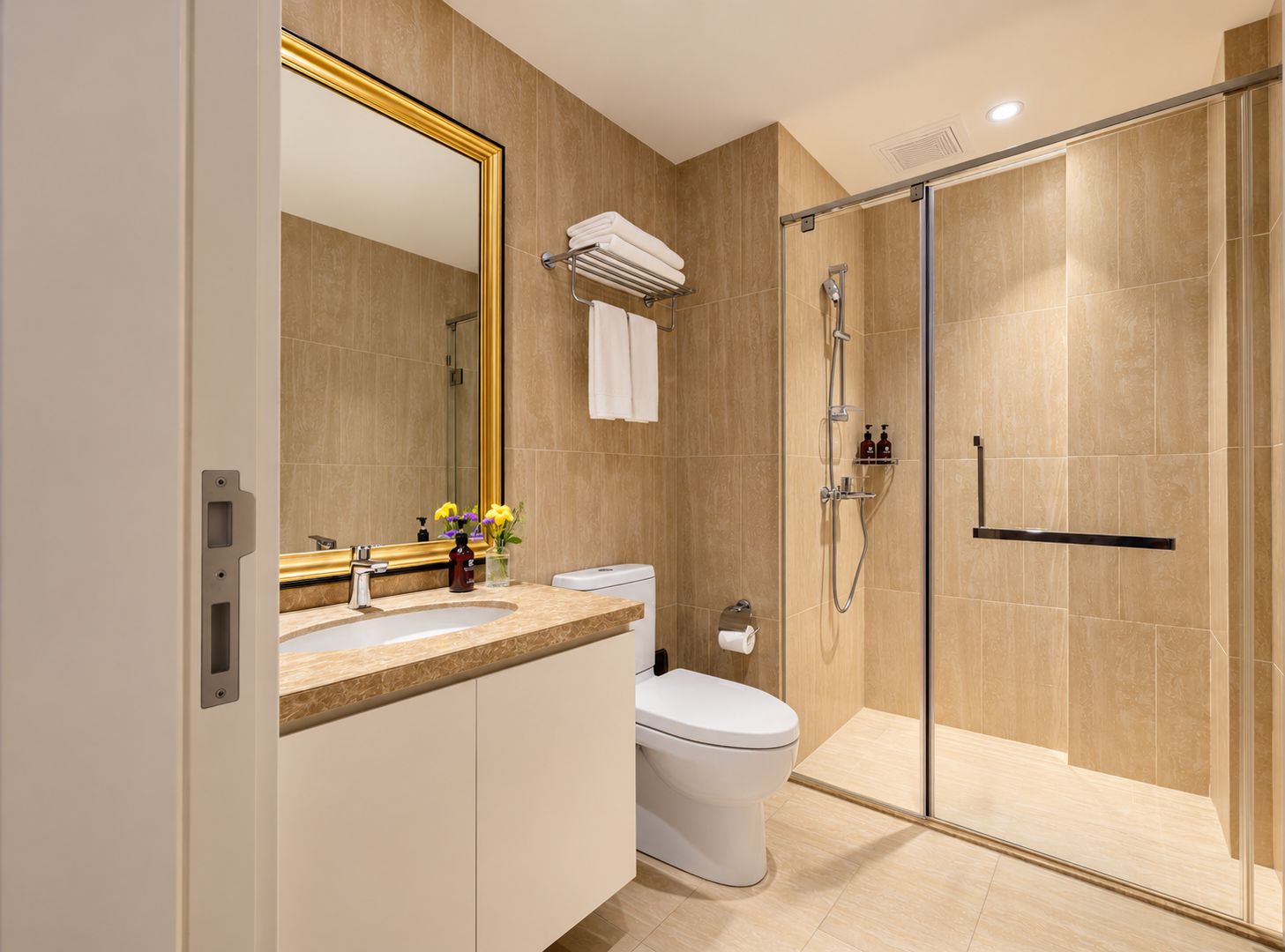 A modern bathroom with a glass-enclosed shower, a white toilet, and a vanity with a mirror.