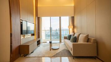 Executive Penthouse, 4 Bedrooms | Living area | 65-inch LED TV with digital channels