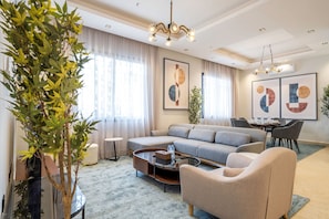 Apartment, 3 Bedrooms | Living area | 55-inch LCD TV with digital channels, TV, books - Mabaat - Al Malqa - 523 (Riyadh)