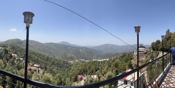 A mountainous landscape with houses and a clear sky.