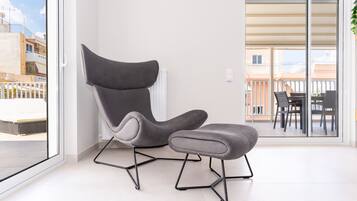 Luxury Apartment | Living area | 50-inch Smart TV with cable channels, TV