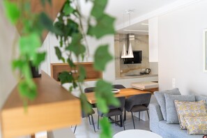 Luxury Apartment | Living area | 50-inch Smart TV with cable channels, TV - Sunny & Luxurious Penthouse with Terrace (Kallithea)