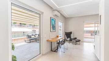 Luxury Apartment | Living area | 50-inch Smart TV with cable channels, TV