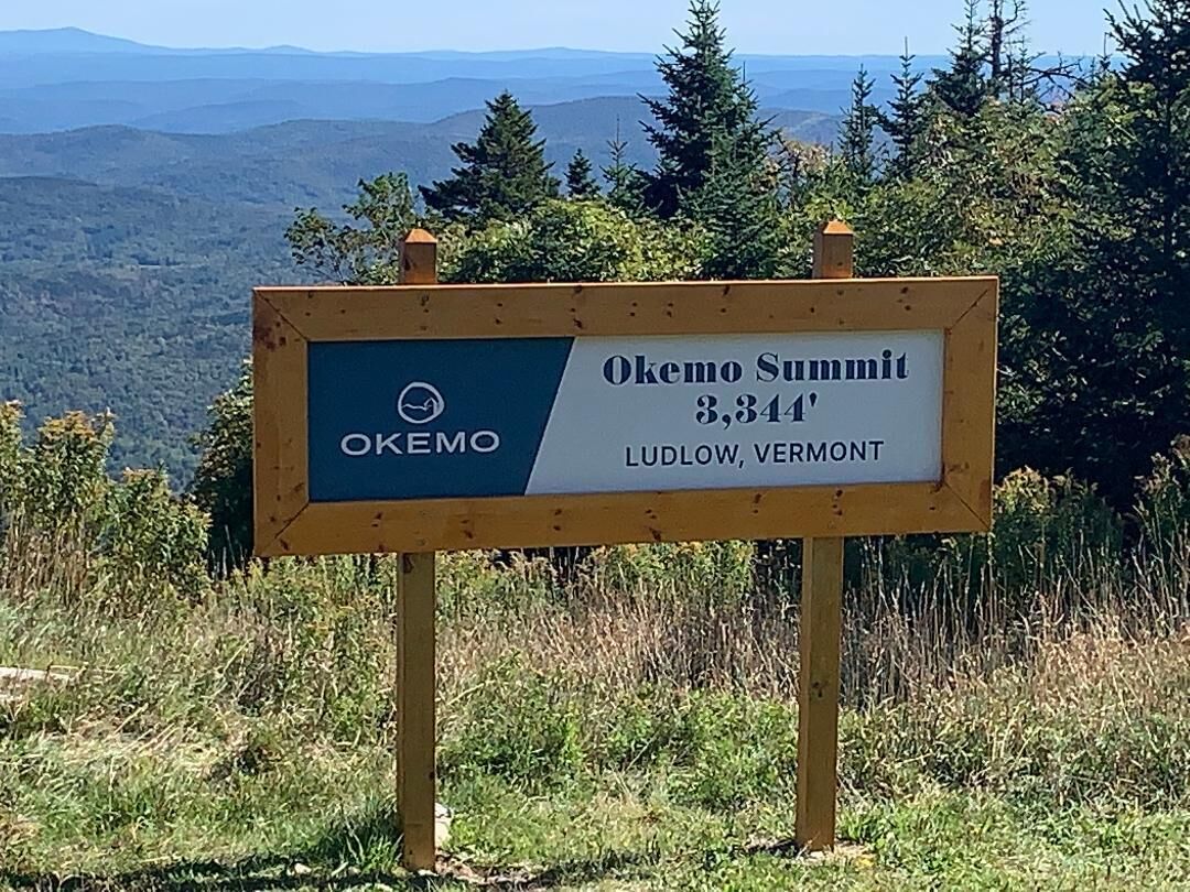 A sign indicating Okemo Summit at 3,344 feet in Ludlow, Vermont.