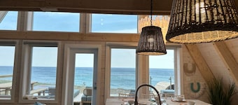 Mystical Beachfront Chalet , Hot tub , Sauna and Heated Container Pool.