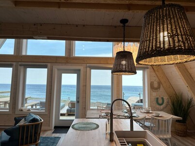 Mystical Beachfront Chalet , Hot tub , Sauna and Heated Container Pool