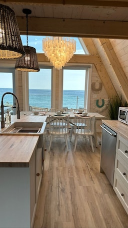 Dining. Mystical Beachfront Chalet , Hot tub , Sauna and Heated Container Pool