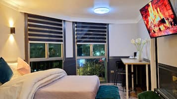 Habitación cuádruple | Cortinas blackout, tabla de planchar con plancha y wifi gratis