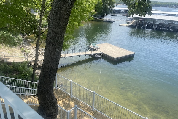 Lake swim dock just steps down from lakeside pool
