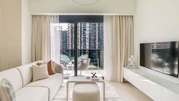 Deluxe Apartment | Living area | 55-inch Smart TV with cable channels, TV