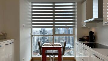 Deluxe Apartment, 3 Bedrooms, City View, Executive Level | Private kitchen | Full-size fridge, microwave, oven, stovetop
