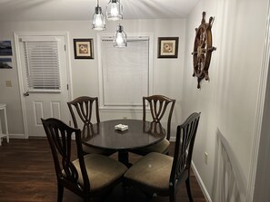 Dining - This two-bedroom cottage features one queen bed, two twin beds, and a sofa bed. (Nantucket)