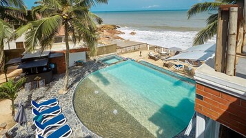 Outdoor pool, open 7:00 AM to 9:00 PM, pool umbrellas