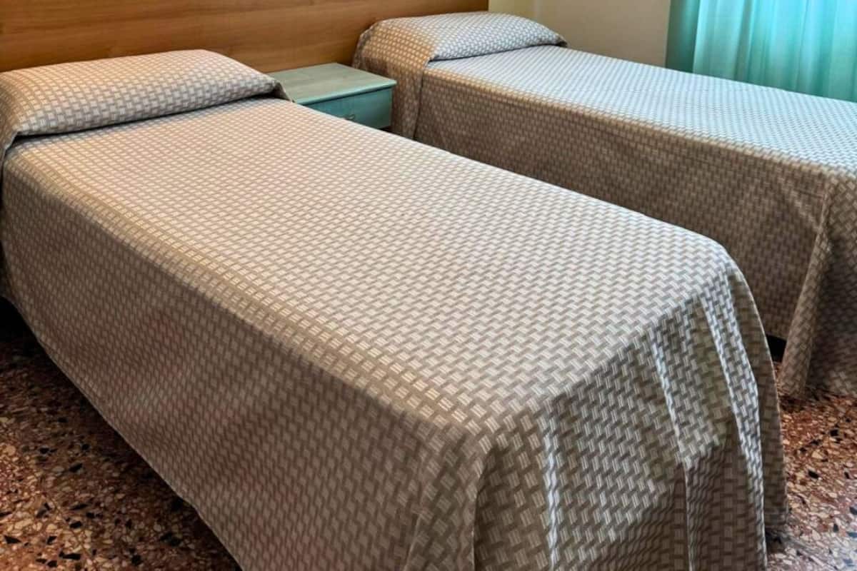 Economy Room, 2 Twin Beds, Partial Sea View | Free WiFi, bed sheets