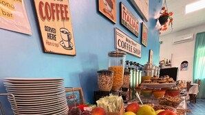 A breakfast buffet with fruits, pastries, and coffee options. - Hotel Valente (Ortona)