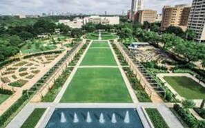 Stroll through the beautifully manicured park, surrounded by serene water features and lush greenery.